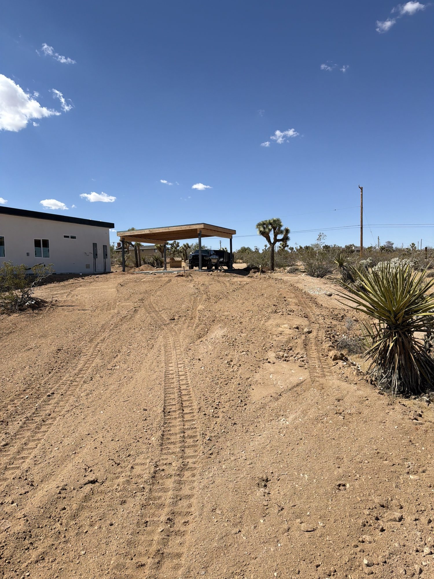 Trench backfilled and graded into a driveway